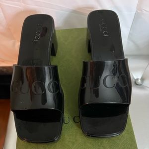 Gucci rubber slides.